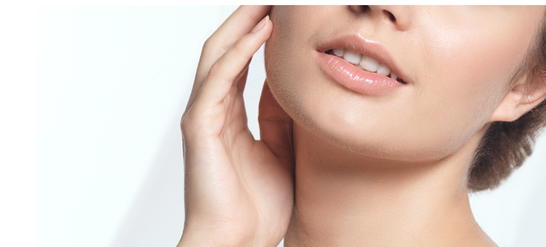 woman feeling her smooth face - What Does Restylane Defyne Do