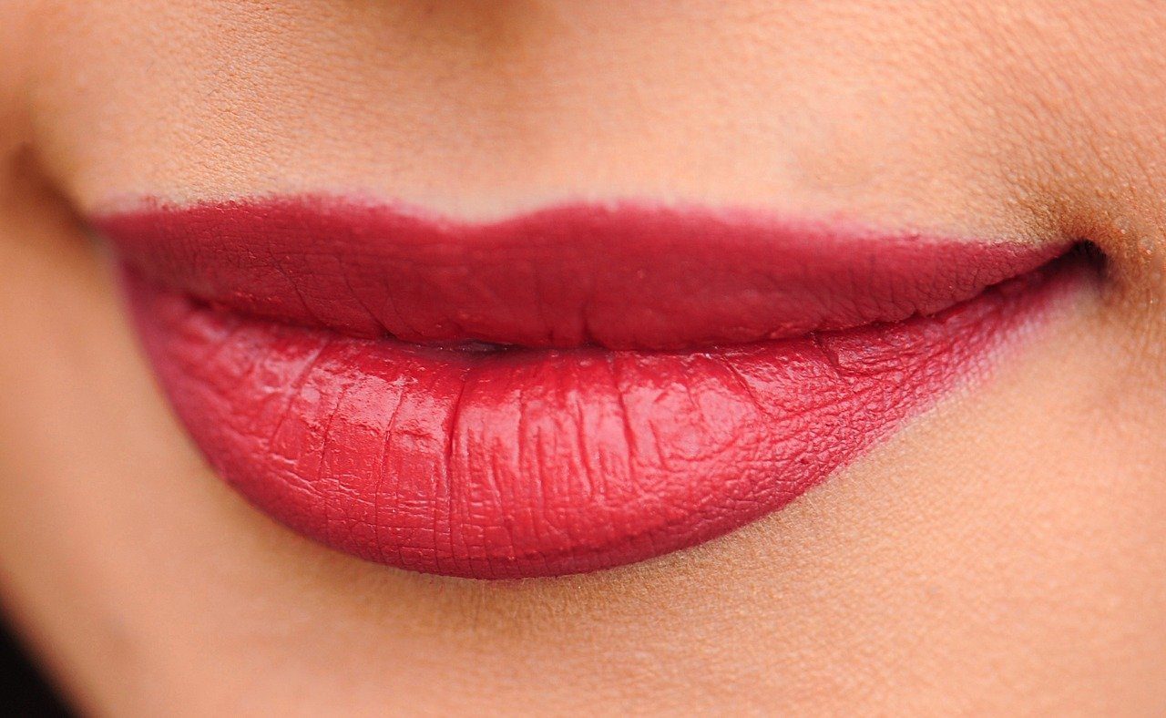 lips red lipstick woman potentially with fillers? - The Myths About Injectables / Lip Injections Enhance concept image